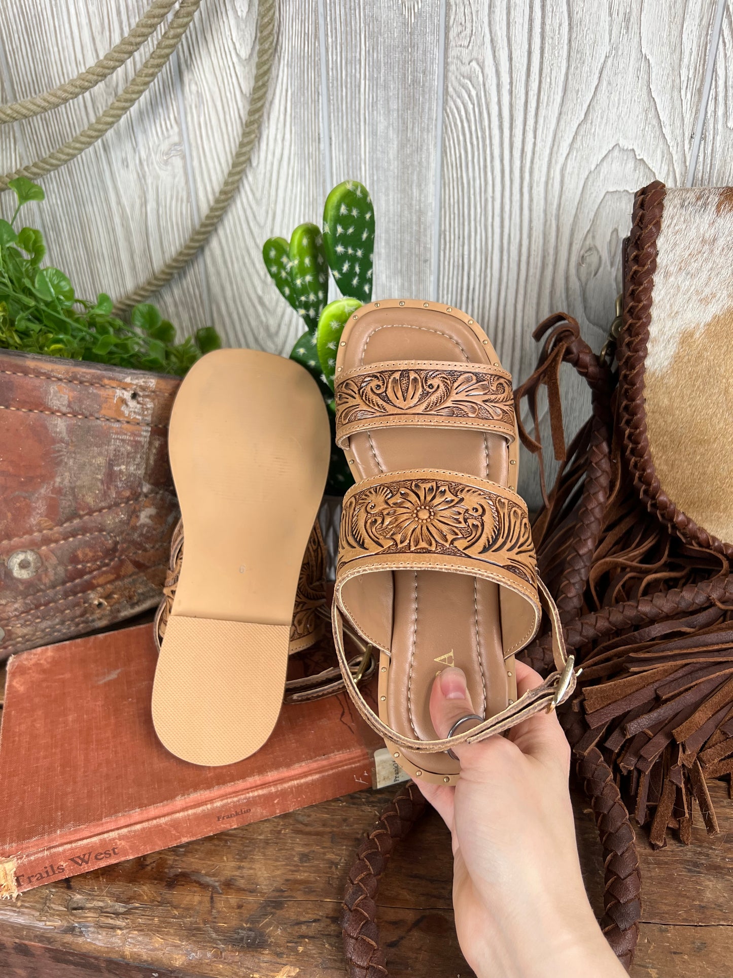 Western cowgirl tooled leather sandals with square toe, gold studs, and small heel