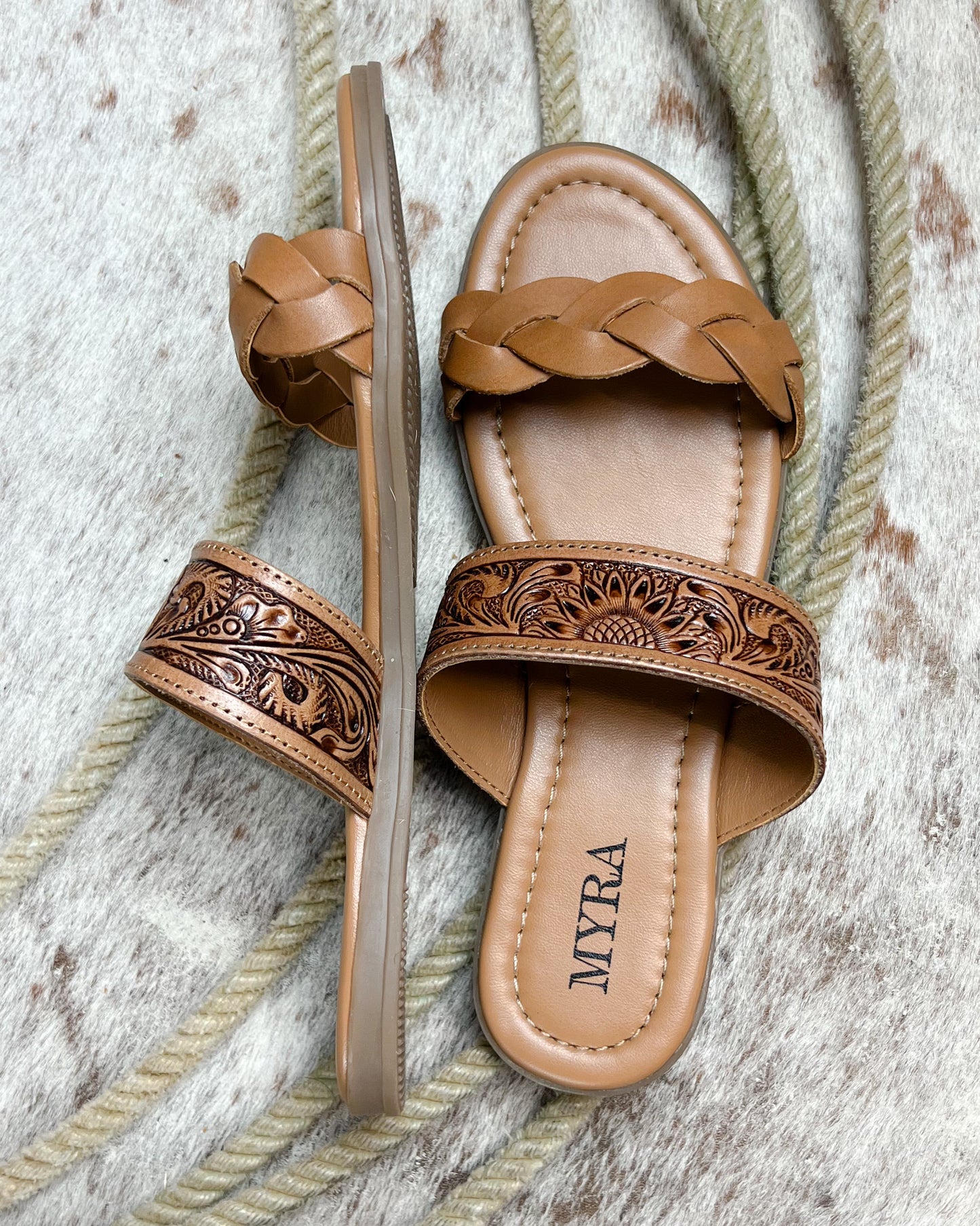 Side view of cushioned western sandals with sunflower tooled leather and braided front strap