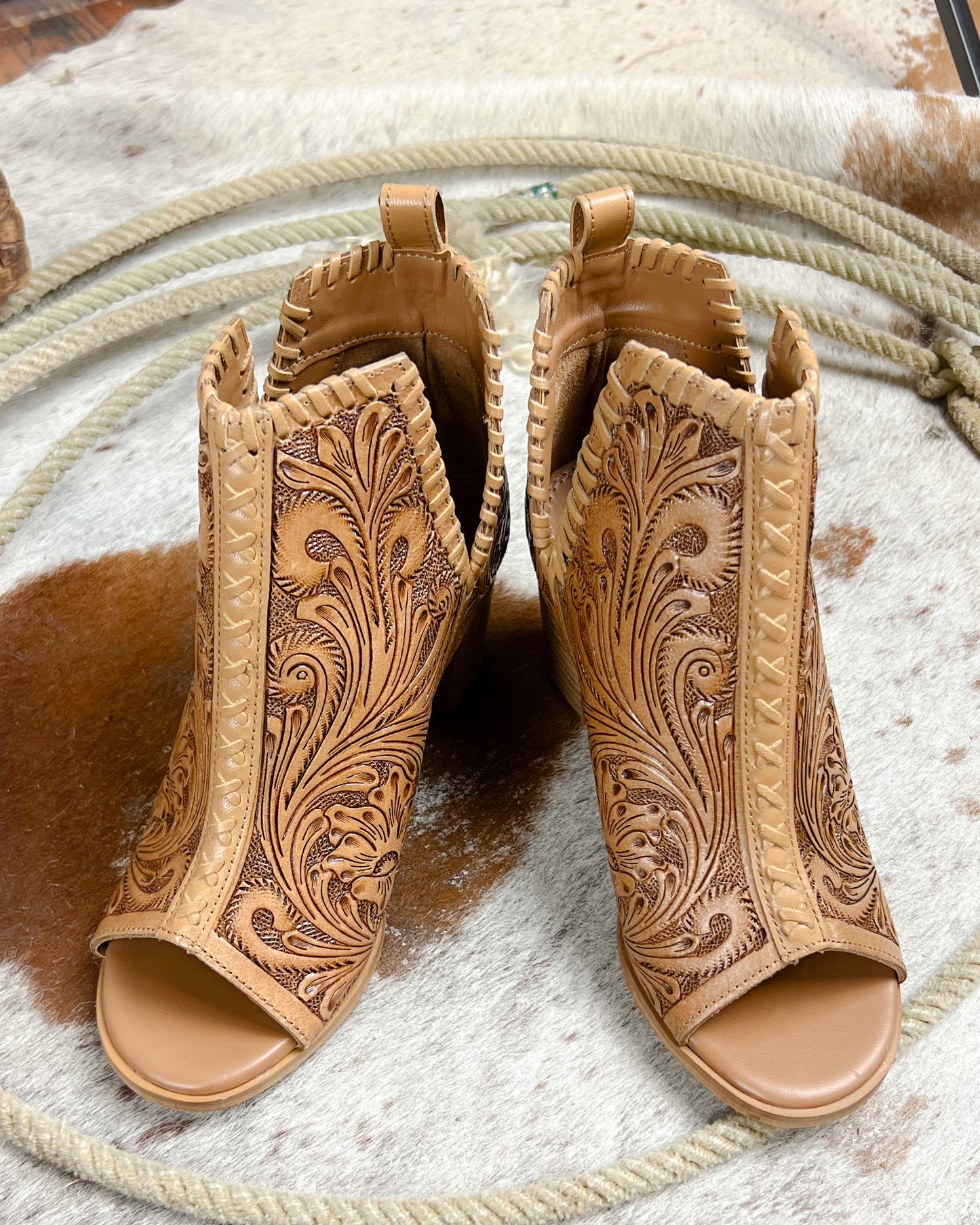 Tooled leather western high heeled booties with floral scroll design and open toe