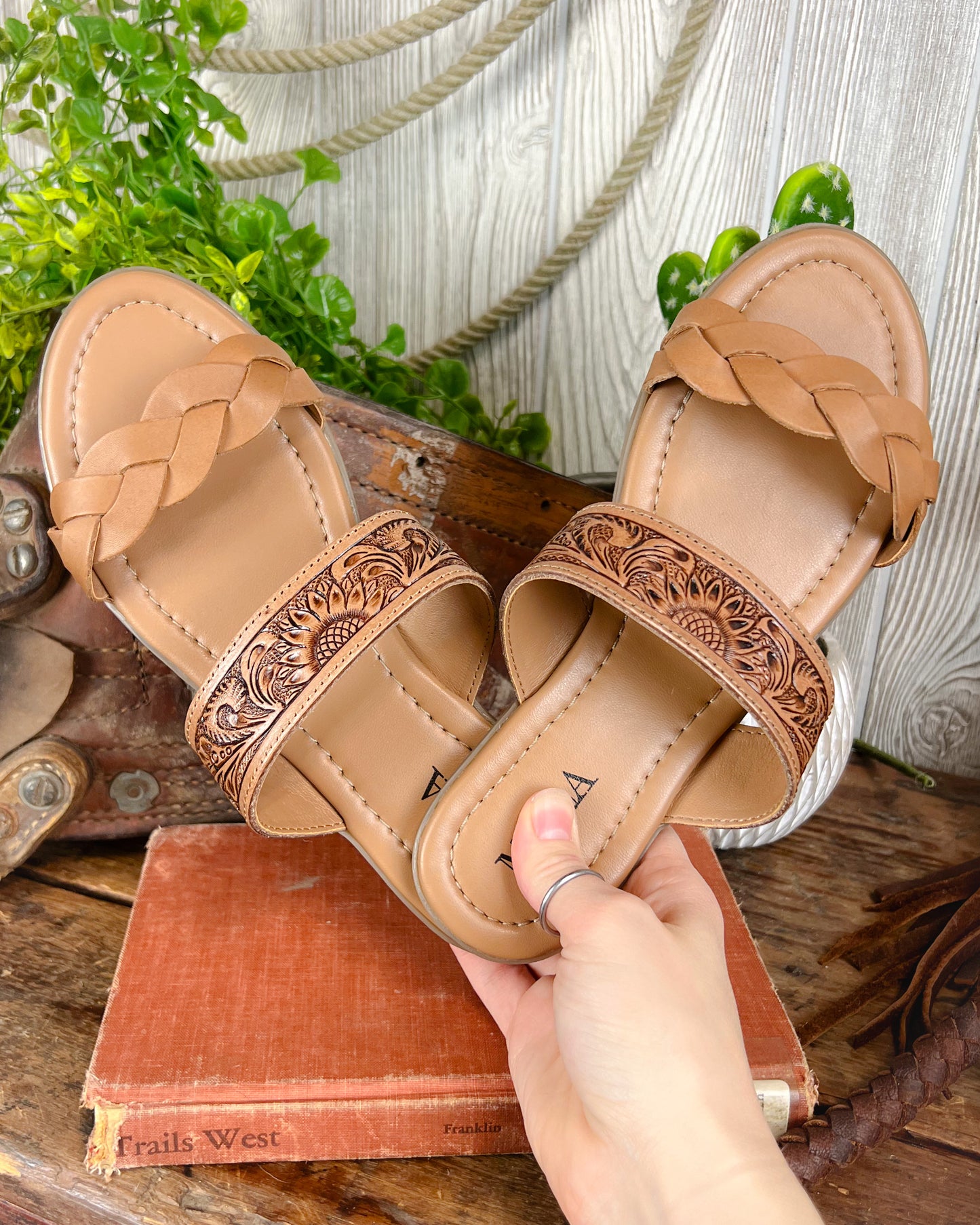 Tooled leather western sandals with sunflower design and braided toe strap