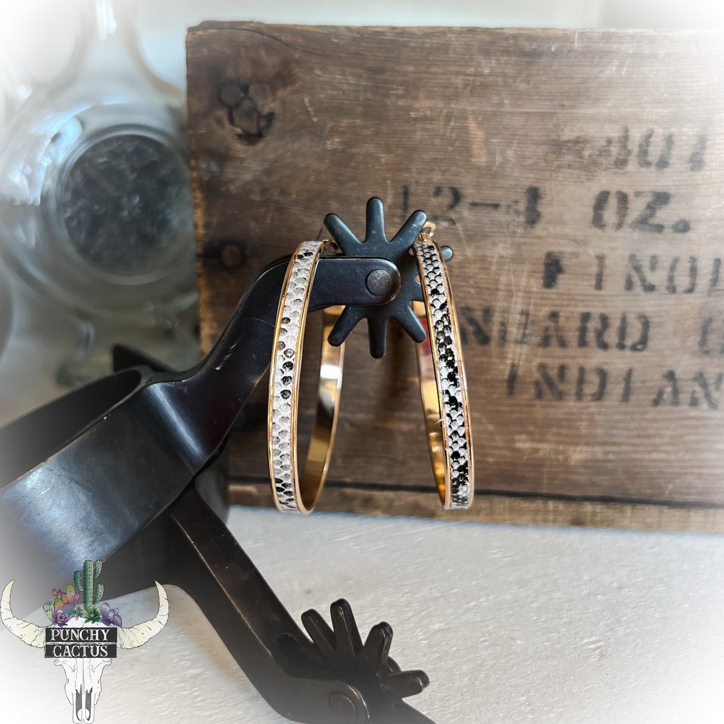 gold hoop earrings with grey and white snake print center