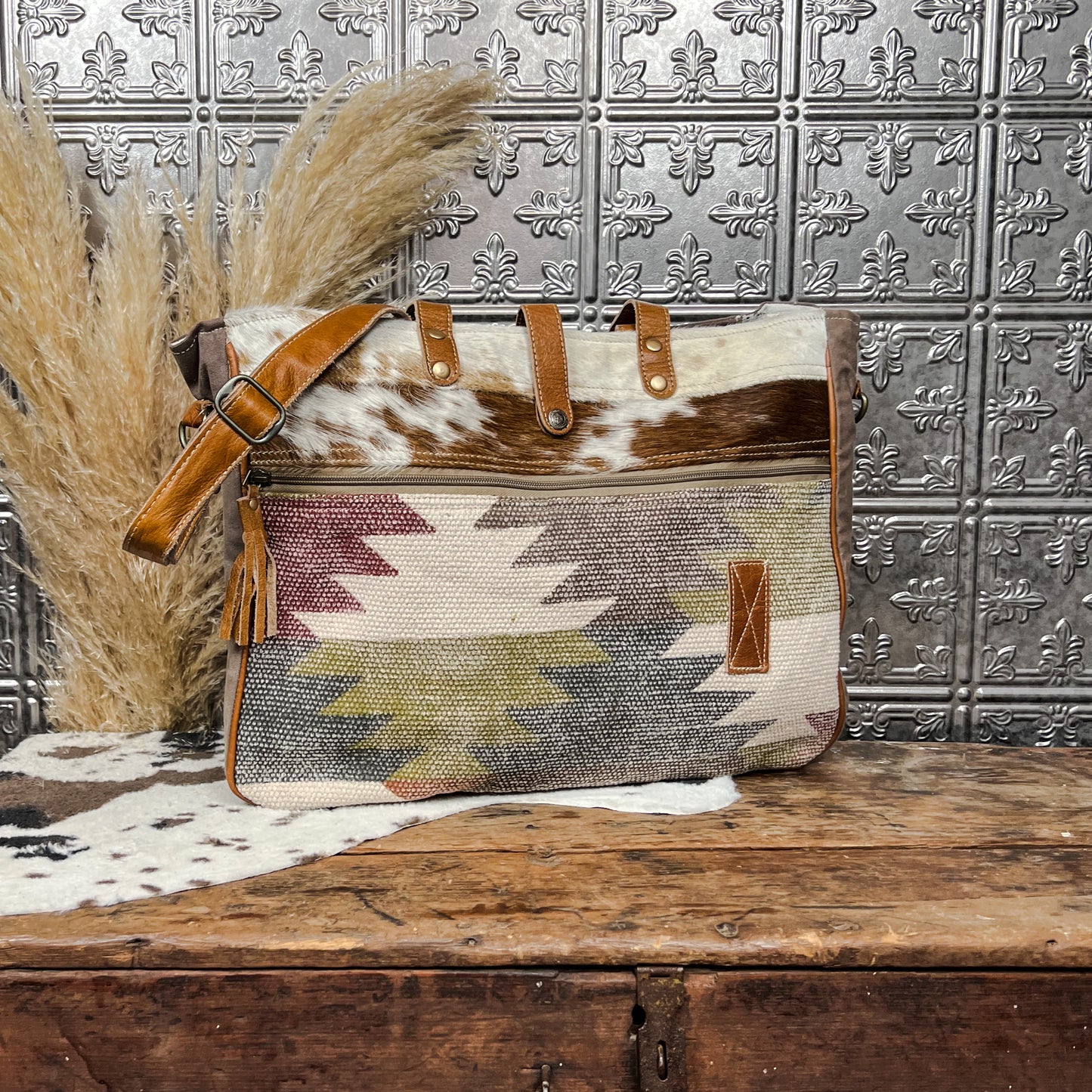 cowhide and axtec print tote weekender bag western boho boutique