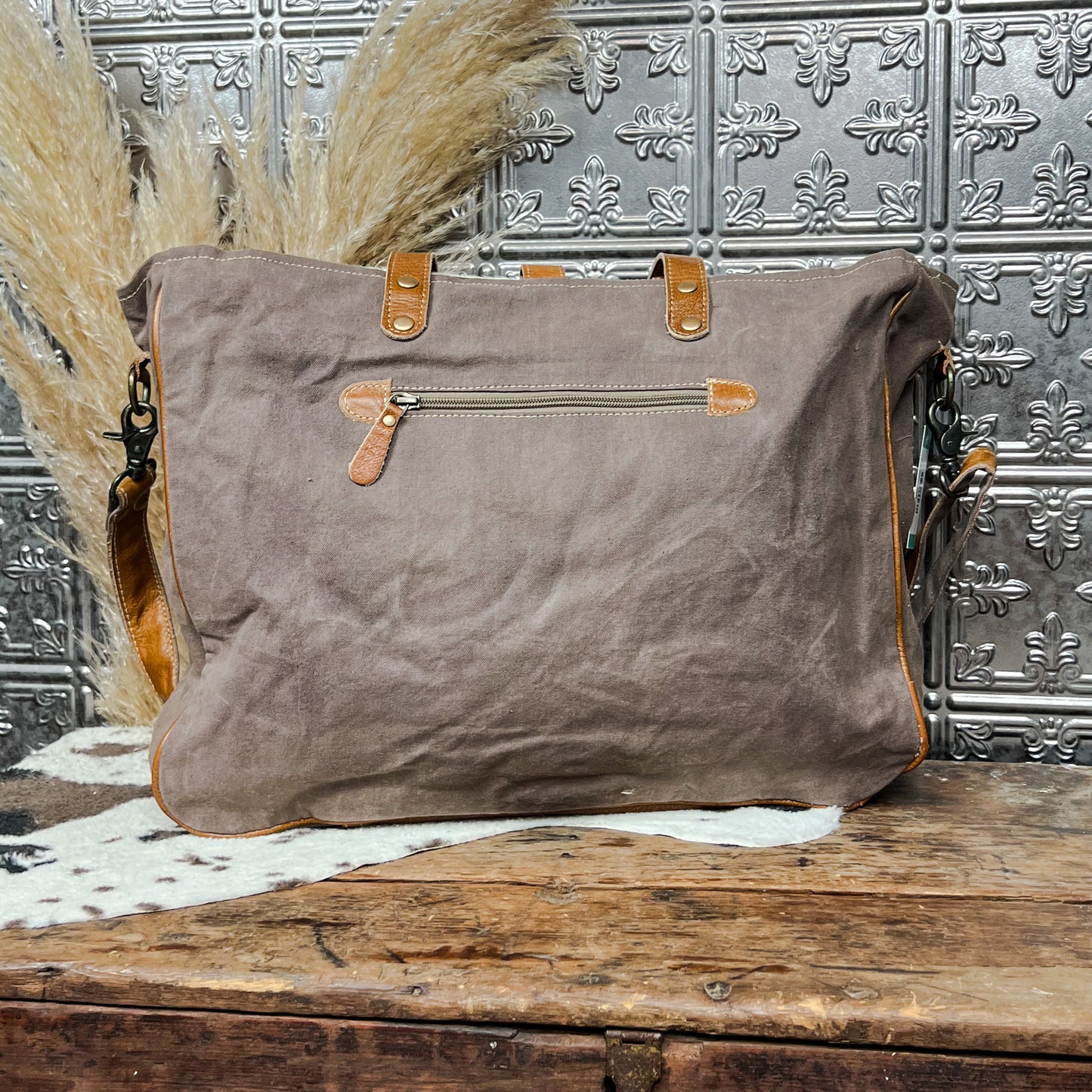 cowhide and axtec print tote weekender bag western boho boutique