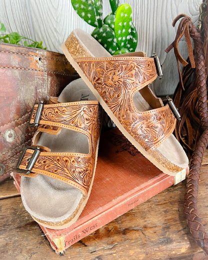 Floral tooled leather Birkenstock-style sandals with adjustable straps and cushioned sole
