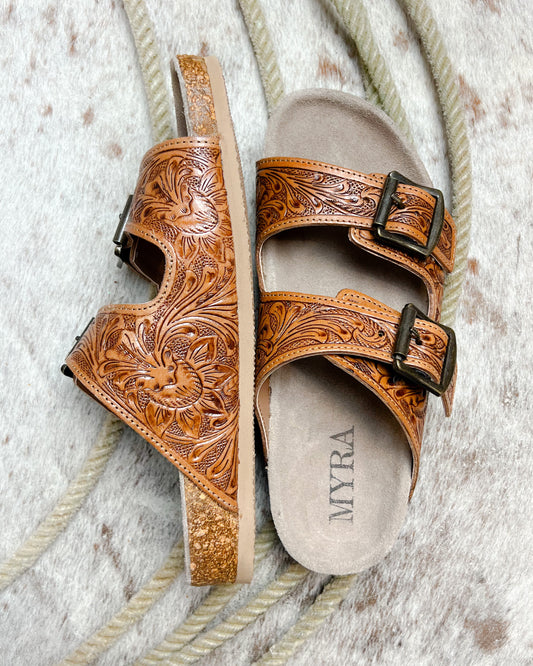 Side view of western-inspired tooled leather sandal with floral pattern and soft footbed