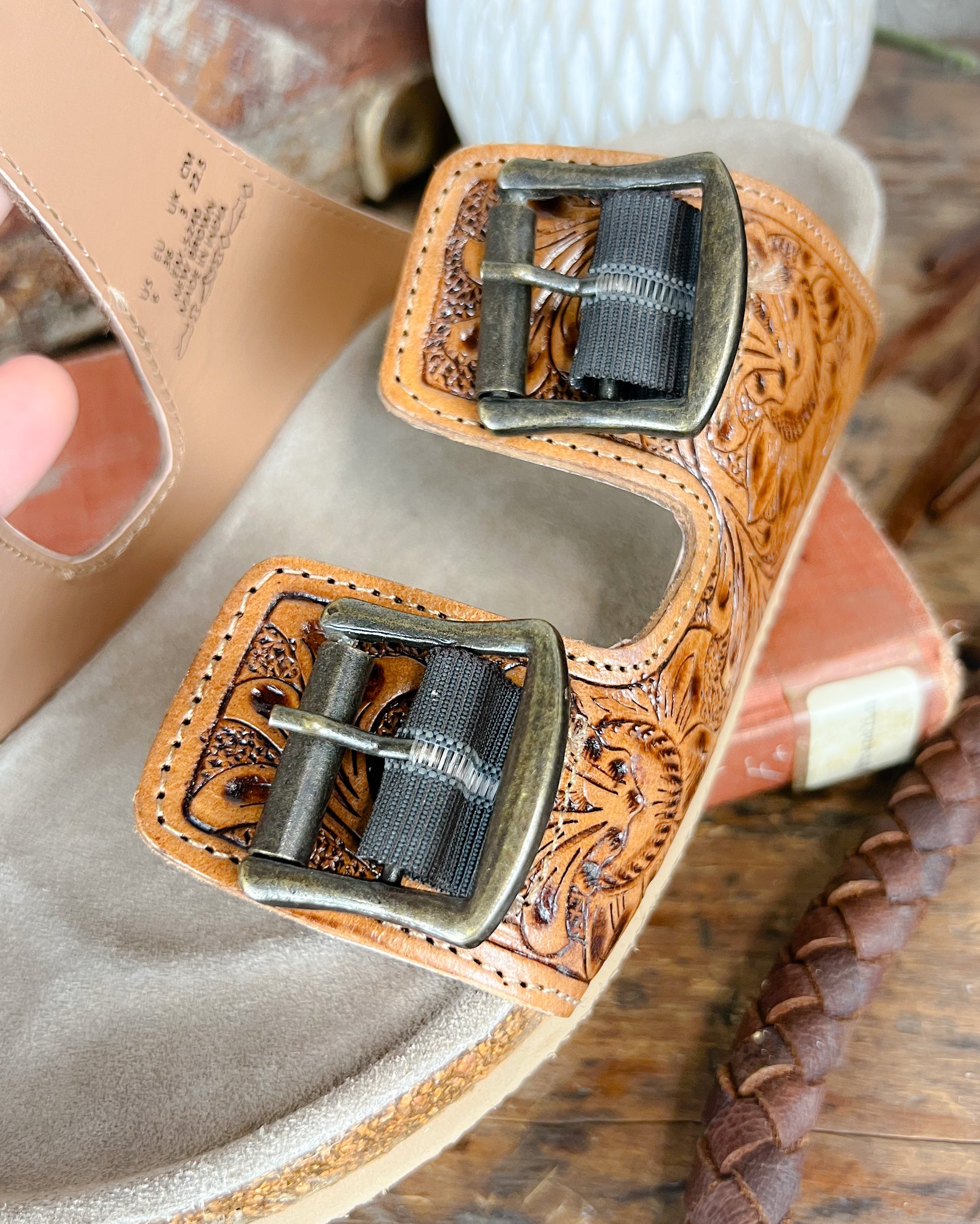 Detail of sandal buckle with elastic stretch insert for added comfort