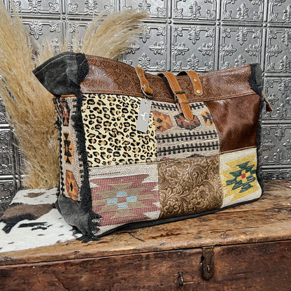 canvas and cowhide patchwork tote style weekender bag western boho boutique