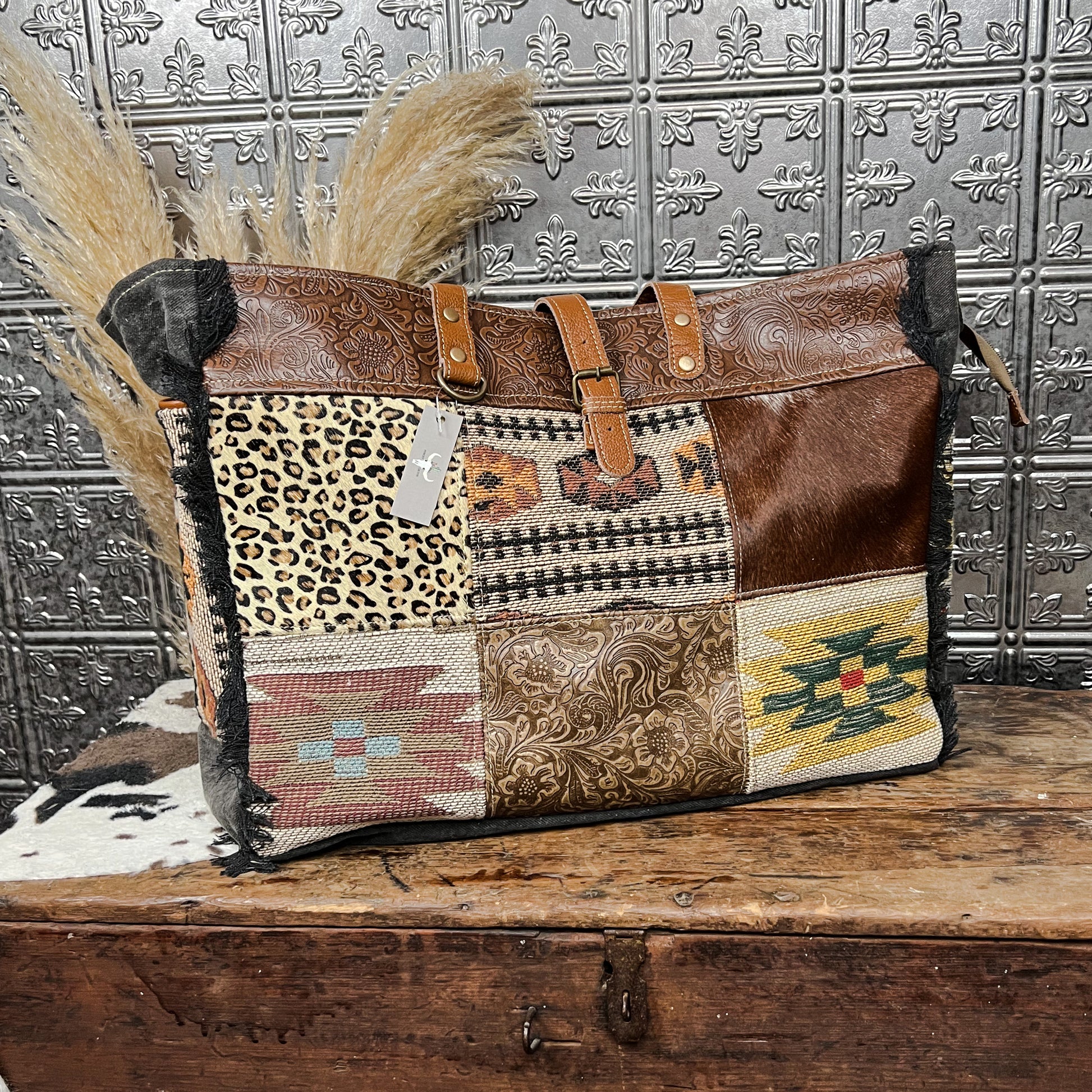 canvas and cowhide patchwork tote style weekender bag western boho boutique