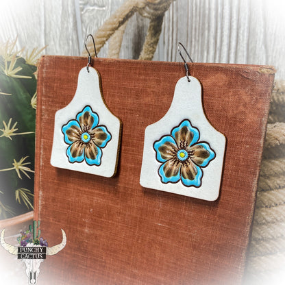 western leather cow tag earrings with flower center tooling - white