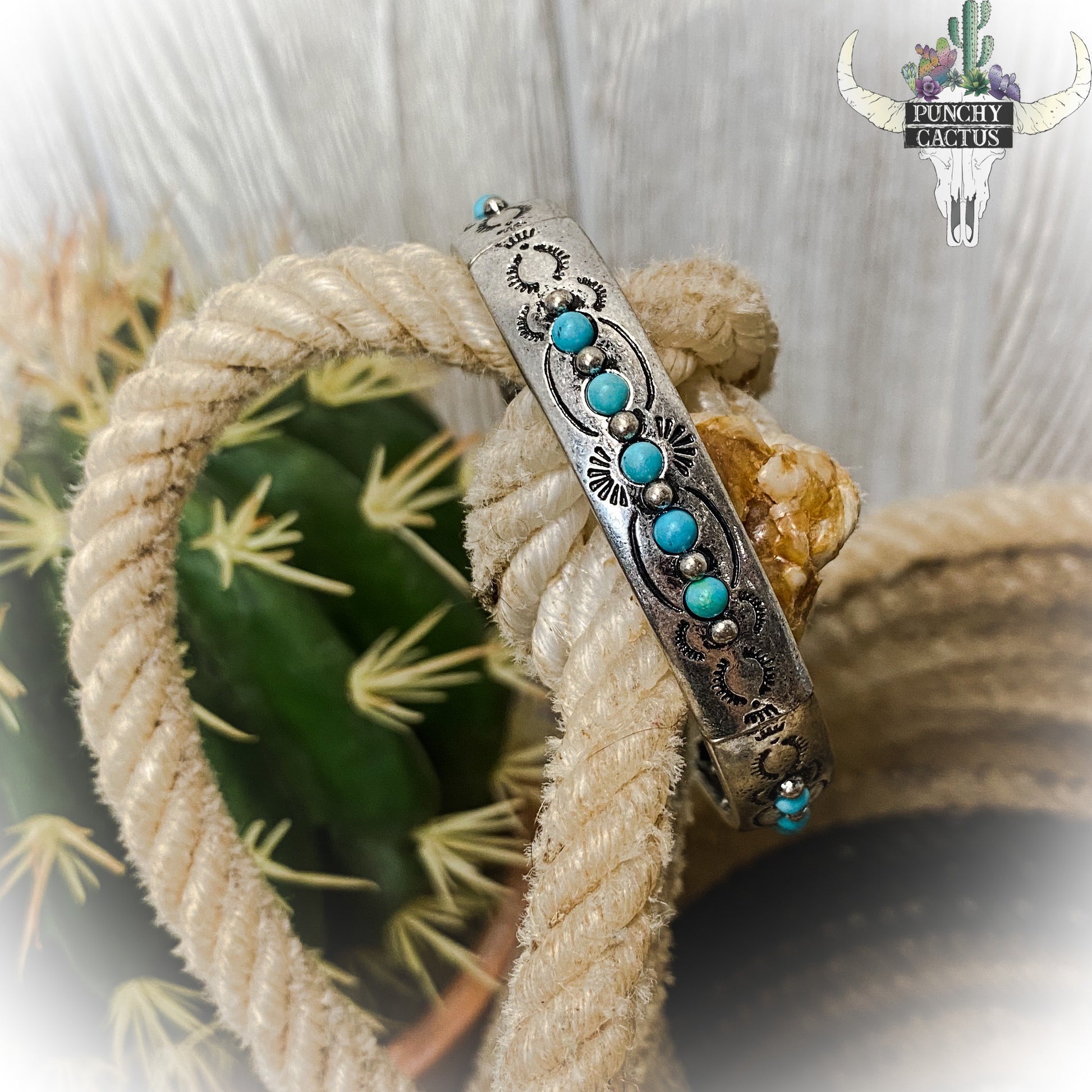western metal stretch bracelet with etching and turquoise stones