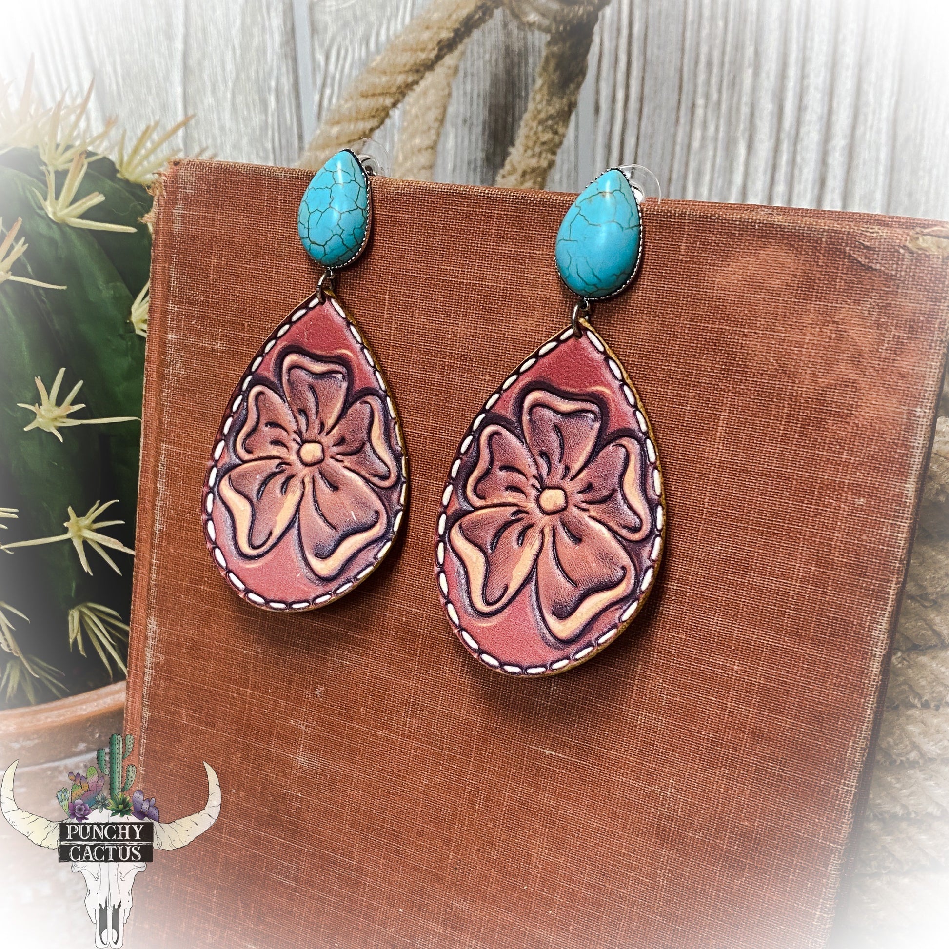 western floral tooled leather earrings with turquoise stone stud